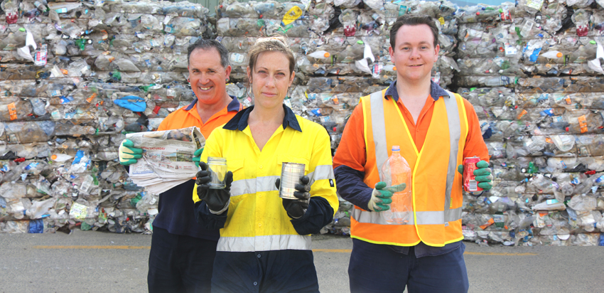 People holding up items of what can be recycled: paper and cardboard, steel and aluminium cans, glass bottles and jars, plastic bottles and containers.