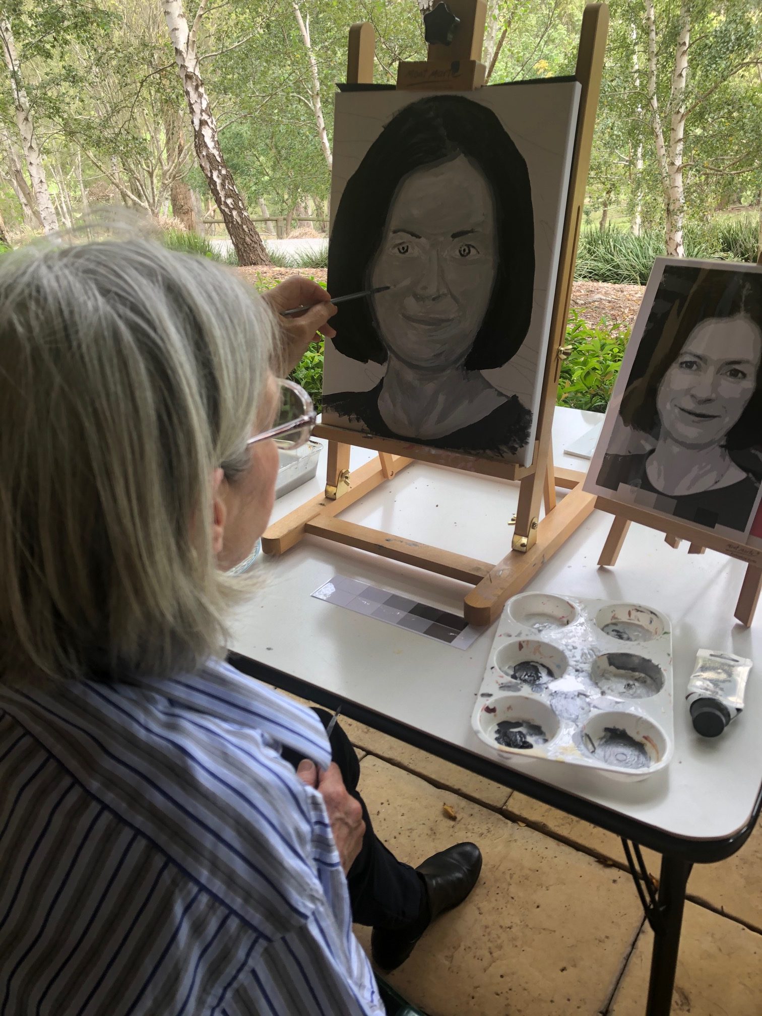 Woman painting portrait