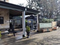 Picture of Berrima Pub with planter boxes placed in front.