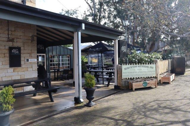 Picture of Berrima Pub with planter boxes placed in front.