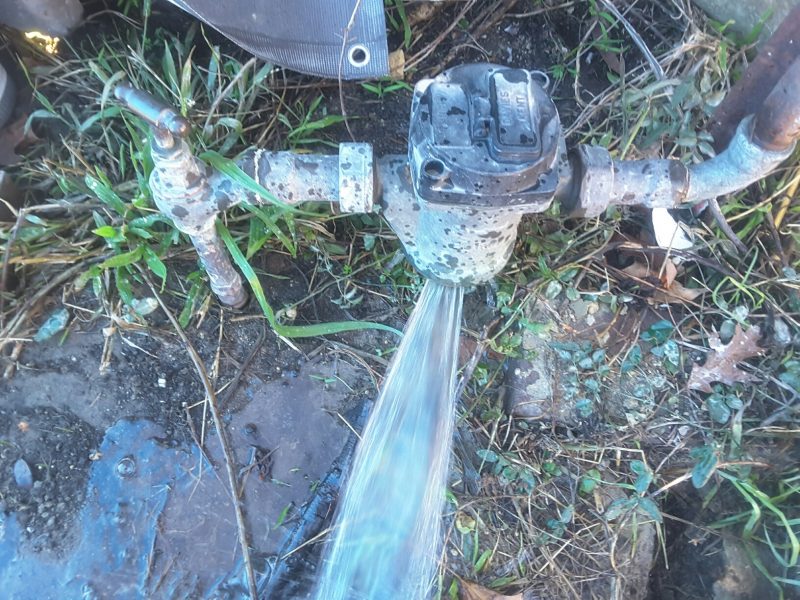 Water exploding out of broken water meter