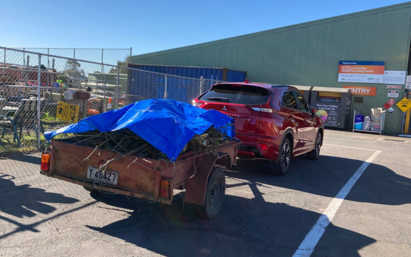 car with trailer and cover over load