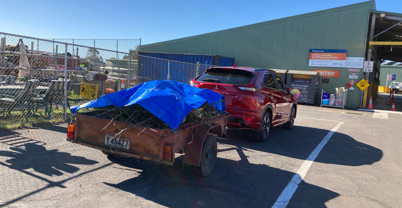 car with trailer and cover over load